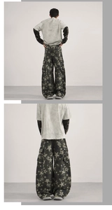 Detail of baggy cargo pants with star camouflage pattern and oversized side pockets