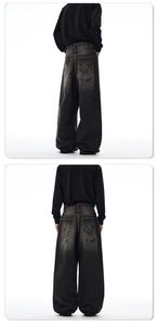 Close-up of baggy black jeans with vintage wash effect and large back pockets