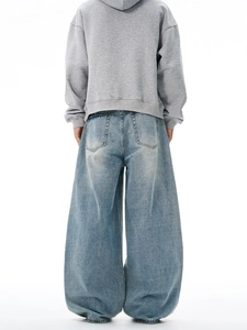 Back view of wide-leg oversized baggy blue jeans with washed vintage finish for men and women