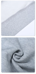Detailed macro view of light gray knit hoodie fabric with high-quality ribbed stitching