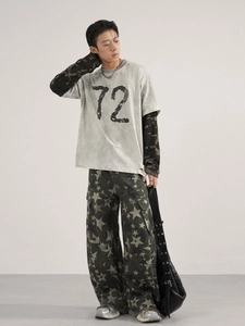 Mens baggy star print streetwear jeans with grey faded graphic tee and cargo pockets