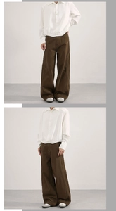 Detail of loose dark brown loose fit twisted seam jeans for men in clean fit style
