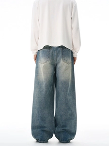 Vintage washed wide-leg blue jeans for men with retro distressed finish and loose fit