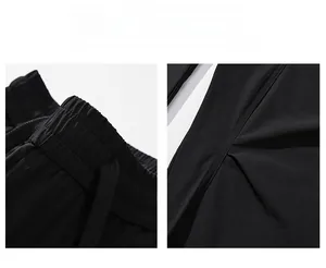 Detail of adjustable elastic waistband with drawstring on black techwear pants