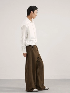 Minimalist men's fashion set featuring a white long sleeve shirt and brown wide leg pants