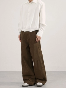 Men's retro loose curved denim pants with deconstructed stitching in deep brown color