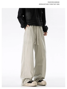 Detail view of cotton drawstring elastic waist on American retro style wide leg trousers