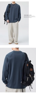 Front and back view of men's Morandi blue crewneck sweatshirt with wide-leg beige pants