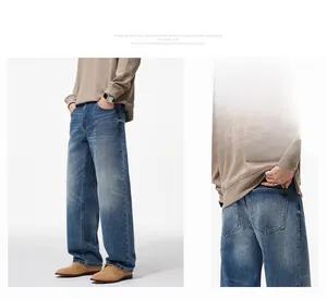 Detailed side view and back pocket of vintage washed blue wide-leg denim jeans for men