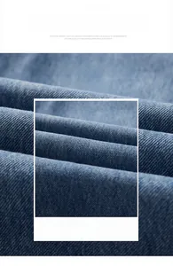 Macro shot of dark blue denim fabric showing breathable twill texture and soft material