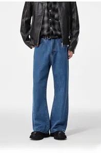 Detail showing vintage wash leather jacket and straight-leg baggy jeans in a streetwear style