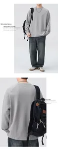Detail view of smoke grey crewneck sweatshirt paired with washed straight-leg denim jeans