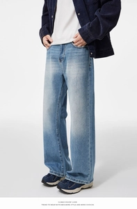 Detail view of American style loose flared jeans with vintage wash and wide-leg fit