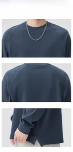 Detail view of crewneck sweatshirt showing raglan sleeves and knit texture details