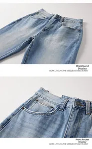 Macro detail of high-waist band and front pockets on light blue washed denim jeans