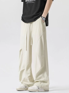 Men's loose quick-dry cream tactical pants with elastic drawstring waist and seam details