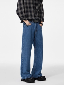 Men's baggy wide leg denim jeans in mid blue color with a stylish city boy loose fit