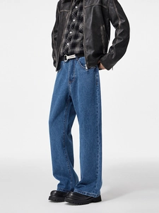 Men's baggy wide leg jeans in dark blue wash paired with a vintage workwear style outfit