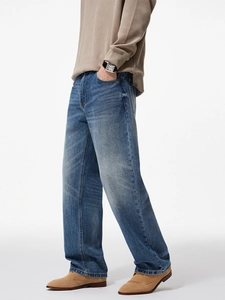 Men's wide-leg straight jeans in vintage blue wash with relaxed fit on a model