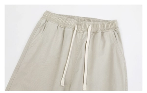 Detail view of cotton twill casual pants with elastic drawstring waist and side pockets