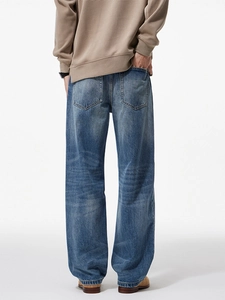 Men's loose straight leg blue washed jeans with vintage faded finish back view display