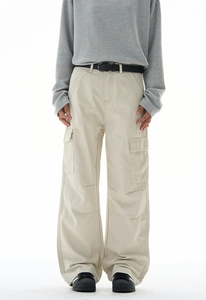 Front view of baggy beige cargo pants with large side pockets and relaxed straight fit
