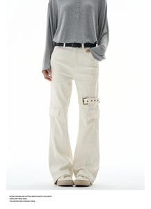 Close-up of utility cargo pants with metal buckle straps and oversized side pockets
