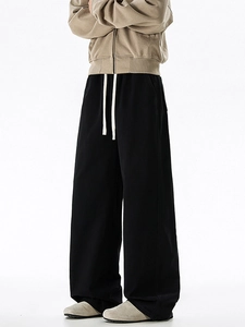 Men's oversized black cotton straight leg trousers with white drawstring and wide fit