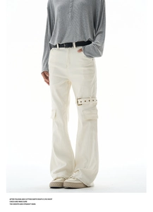 Detail of cargo flare pants featuring multi-pocket design and metal buckle webbing