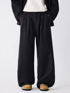 Minimalist black wide-leg trousers with vertical texture and relaxed straight fit
