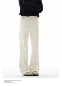 Detailed close-up of off-white cargo pants featuring large side pockets and knee seams