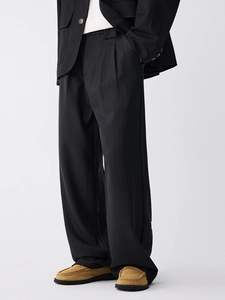 Men's high-waisted black wide-leg trousers with elegant drape and pleated front design
