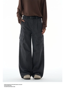 Detailed close-up of charcoal grey wide-leg cargo pants with large side pockets and belt