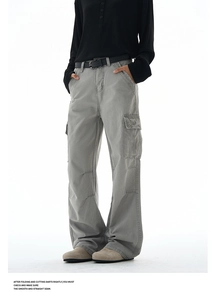 Detail of cargo pockets and washed cotton fabric on retro baggy straight-leg utility pants