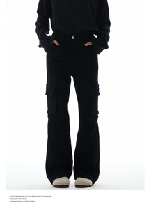 Detailed view of high-waisted black utility cargo jeans with flap pockets and white metal button