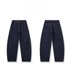 Flat lay of indigo wide-leg jeans showing front and back views with curved seams