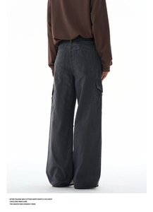 Detail view of smooth and straight seams on black cotton cargo pants from the rear perspective