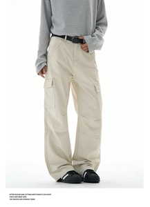 Detail of baggy cargo pants with oversized side pockets and a black leather belt