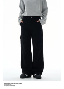 Detail view of black wide-leg cargo pants with large flap pockets and straight-cut fit