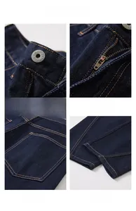 Detail view of denim jeans featuring YKK zipper, metal button, and shield back pocket