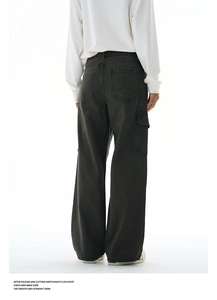 Detail view of the back pockets and relaxed wide-leg fit of these cotton cargo trousers