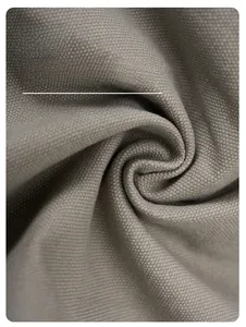 Close-up of grey high-density fabric texture showing breathable cotton weaving detail