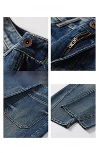 Dettagli dei jeans lavati vintage con cerniera YKK e chiusura con bottone in bronzo