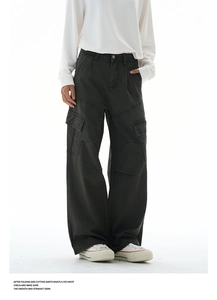 Detailed view of the large flap side pocket and stitching on cargo workwear pants