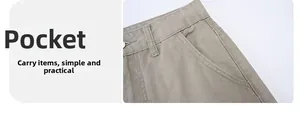 Detail of khaki cotton cargo pants featuring functional side pockets and clean stitching