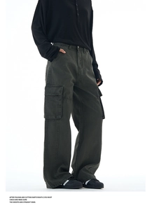 Detailed close-up of dark grey cargo pants with side pockets and premium stitching