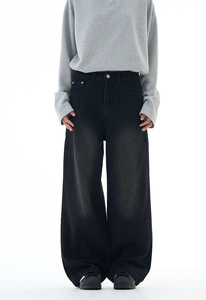 Detail of vintage washed wide-leg denim jeans with retro cat whiskers and baggy fit