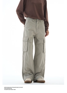Detail showing high-quality stitching and side cargo pockets on wide-leg khaki trousers