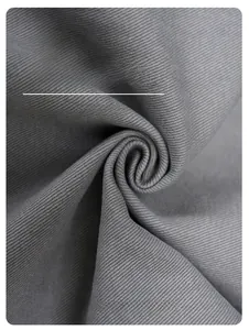Macro shot of grey twill fabric texture showing high-quality fiber details and durability