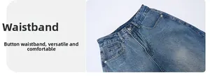 Detailed view of blue washed denim waistband featuring silver button and metal zipper